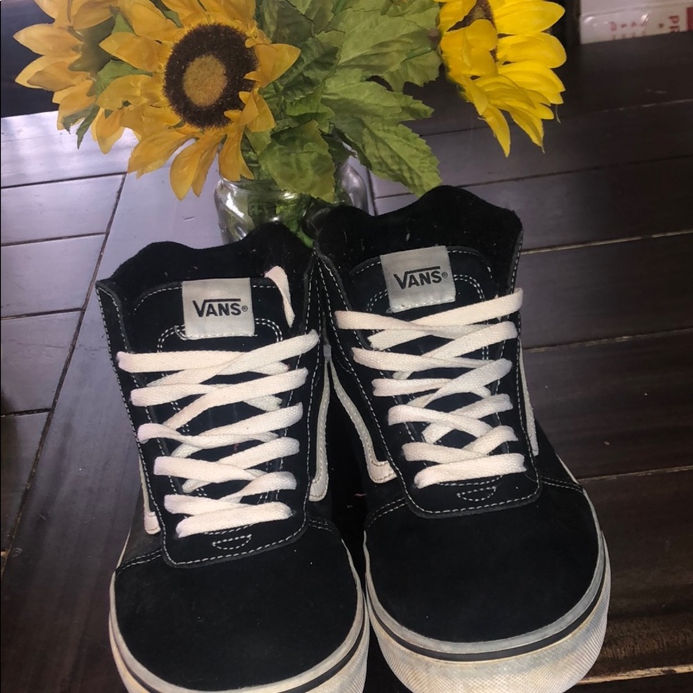 Black and white high top vans